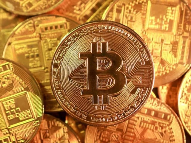Bitcoin rises above $80,000 as soft dollar, debasement fears boost momentum