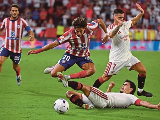 Atletico down Sevilla to go top of La Liga