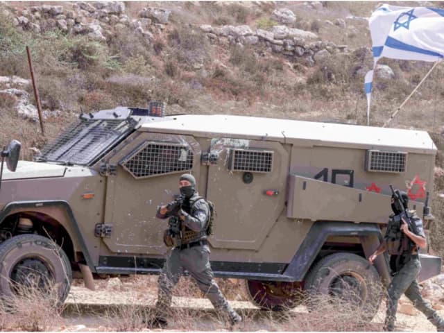 Dozens of Israeli settlers attack West Bank village